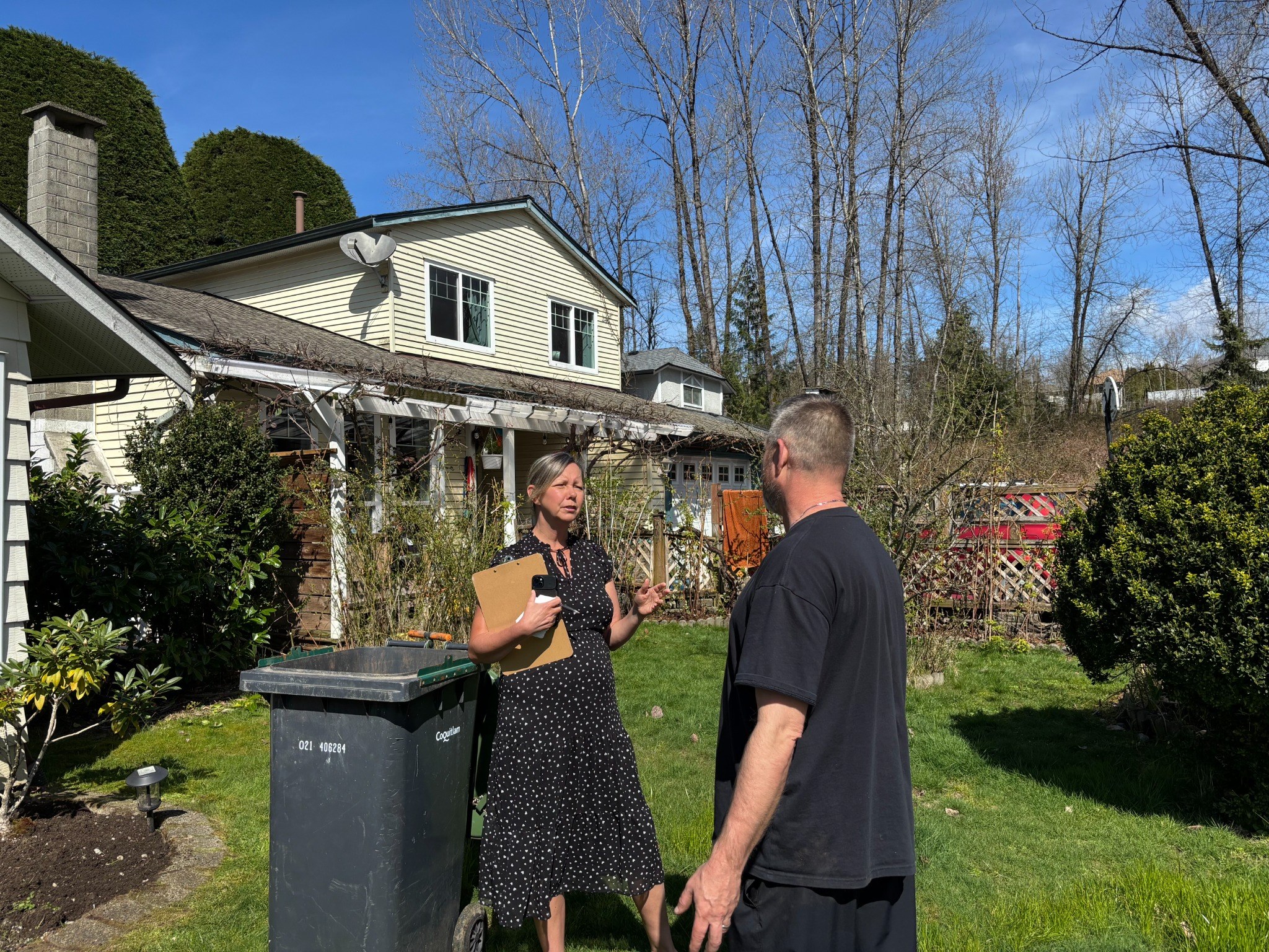 Jane Thomsing speaking with a Coquitlam resident